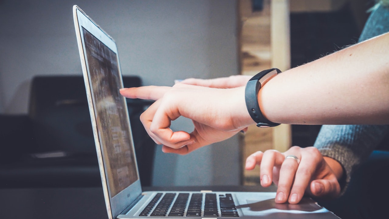 Person working on laptop — HTML best practices