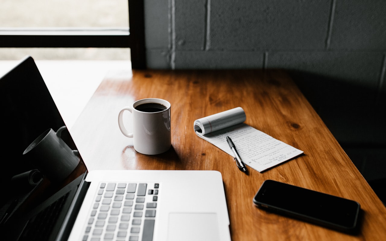 Editorial Magazine Layout — laptop and notebook workspace